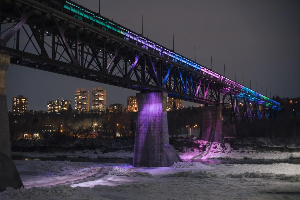 Edmonton's High-level Bridge is lit up for New Year's Eve in Edmonton, Alberta, Thursday, Dec. 31, 2020. (Amber Bracken/The Canadian Press via AP)