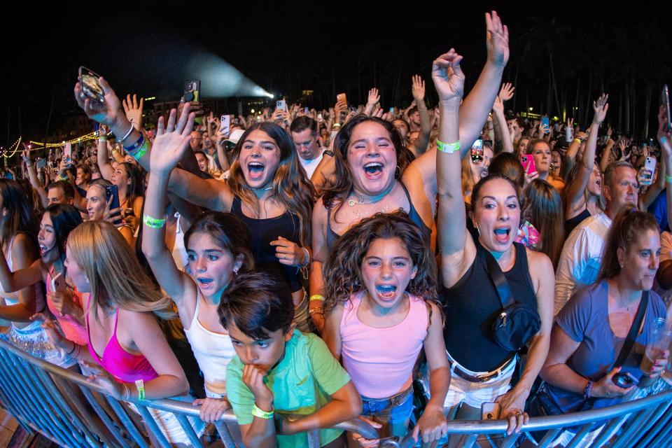 Fans cheer for Flo Rida during his performance at Sunfest in West Palm Beach, Florida on May 5, 2023. 