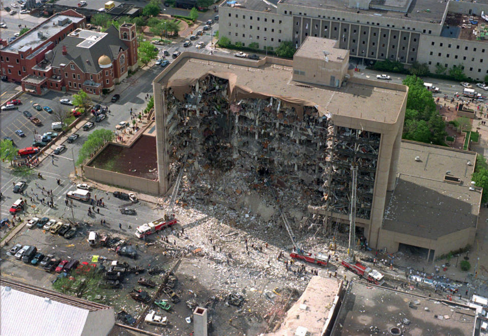 FILE - In this April 19, 1995, aerial file photo, the north side of the Alfred P. Murrah Federal Building in Oklahoma City is pictured after an explosion that killed 168 people and injured hundreds. As part of the city's annual day of remembrance Friday, April 19, 2019, – the 24th anniversary of the attack – civic leaders will plant a tree that was cloned from the Survivor Tree - a scarred American elm that survived the deadliest act of domestic terrorism on U.S. soil. (AP Photo/File)