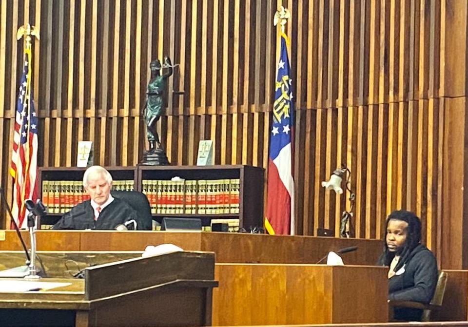 Xavier Stevenson, right, testifies during the murder trial of his former roommate, Quincy Tyrek Wade.