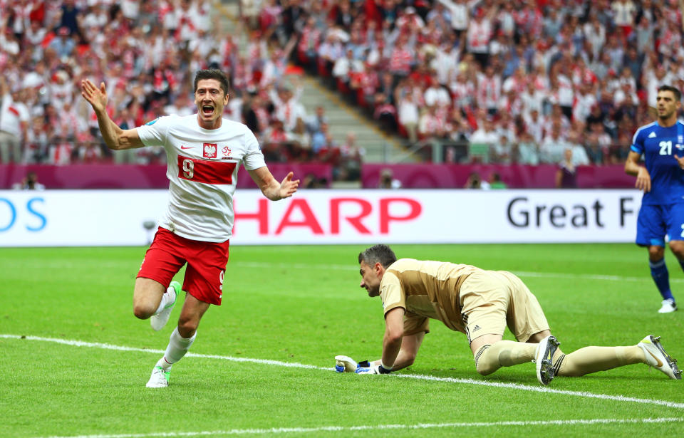 WARSAW, POLAND - JUNE 08: Robert Lewandowski of Poland celebrates scoring the opening goal during the UEFA EURO 2012 Group A match between Poland and Greece at National Stadium on June 8, 2012 in Warsaw, Poland. (Photo by Michael Steele/Getty Images)