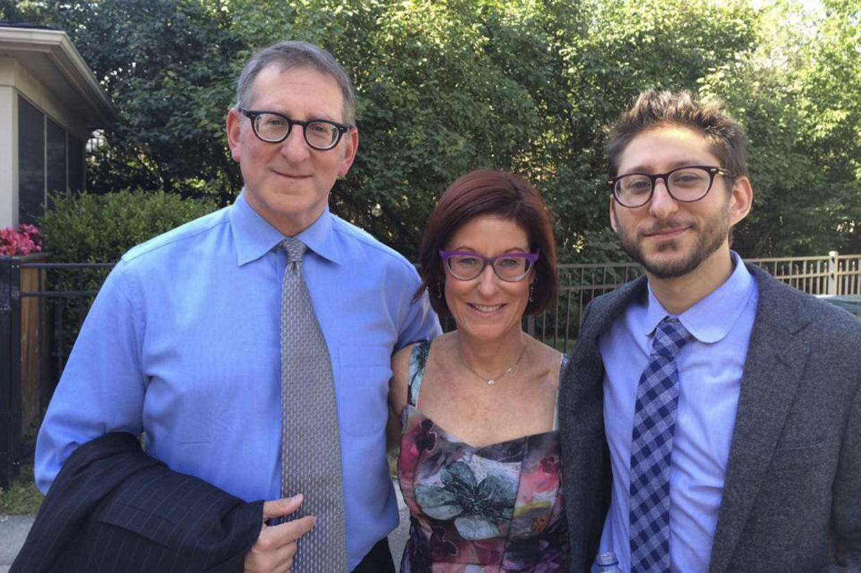 FILE - Buddy, from left, and Rose Fenster, and their son Danny Fenster pose for a photo in Huntington Woods, Mich., in 2014. Former U.S. Ambassador to the U.N. Bill Richardson says American journalist Danny Fenster has been released from prison in Myanmar.(family courtesy photo via AP, File)
