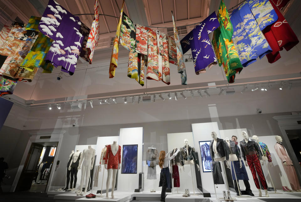 Stage costumes and kimonos worn by Freddie Mercury are displayed at Sotheby's auction rooms in London, Thursday, Aug. 3, 2023. More than 1,400 of Freddie Mercury's personal items, including his flamboyant stage costumes, handwritten drafts of “Bohemian Rhapsody” and the baby grand piano he used to compose Queen's greatest hits, are going on show in a free exhibition at Sotheby's London ahead of their sale. (AP Photo/Kirsty Wigglesworth)
