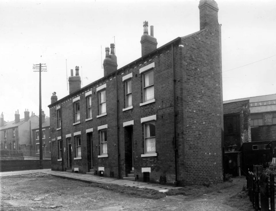 The view on the left looks up Rothsay Place, across Little Town Lane to Lansdowne Mount Rothsay Place has an unsurfaced road in September 1960. Behind the houses is a yard area with sheds and out buildings also industrial premises used by Waterhouse's toffee makers and Northern Chairworks. (Photo: West Yorkshire Archive Service)