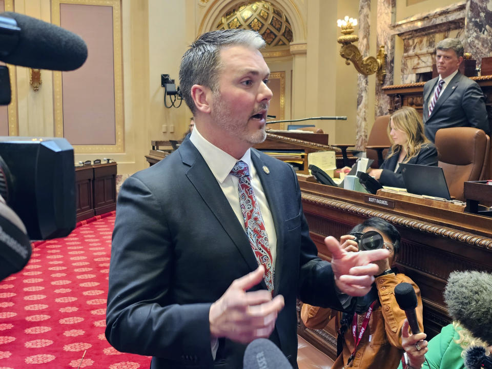 Minnesota Senate Republican Minority Leader Mark Johnson talks with reporters on the Senate floor in the Minnesota State Capitol after a Republican attempt to expedite an ethics investigation of Democratic Sen. Nicole Mitchell, who's facing a felony burglary charge, failed on a tie vote, Wednesday, April 24, 2024 in St. Paul, Minn. (AP Photo/Steve Karnowski).