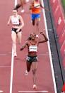 <p>Faith Kipyegon of Team Kenya reacts after winning the gold medal during the Women's 1500m Final. </p>