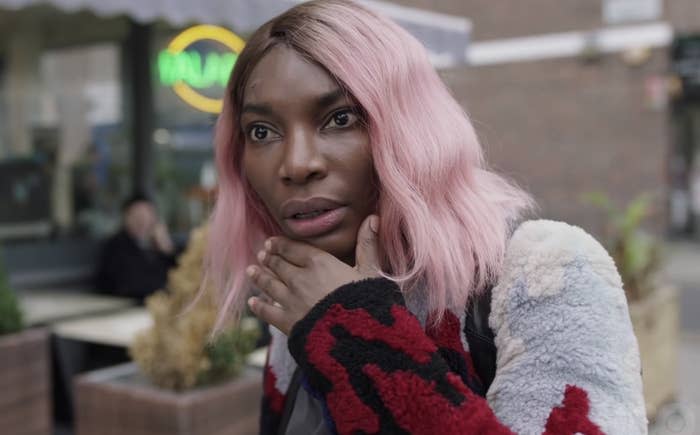 Michaela Coel in a scene from I May Destroy You, standing on the street looking shocked