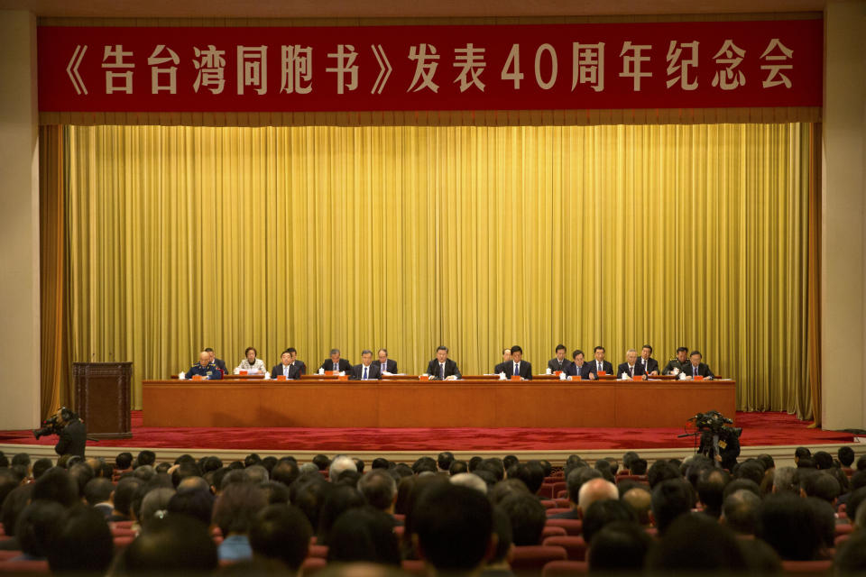 Chinese President Xi Jinping, center, speaks during an event to commemorate the 40th anniversary of the Message to Compatriots in Taiwan at the Great Hall of the People in Beijing, Wednesday, Jan. 2, 2019. (AP Photo/Mark Schiefelbein, Pool)