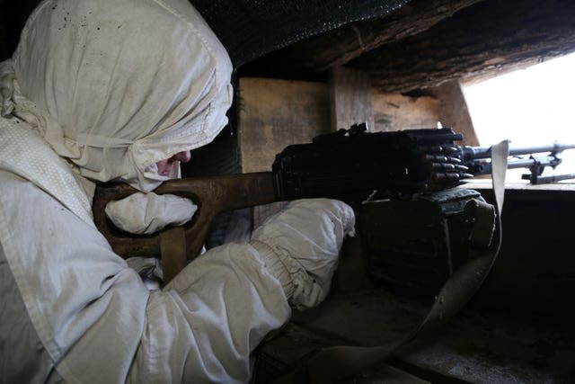 A serviceman takes his position in a trench at the line of separation near Yasne village, about 33,6 km (21,2 miles) south-west of Donetsk, controlled by Russia-backed separatists, eastern Ukraine