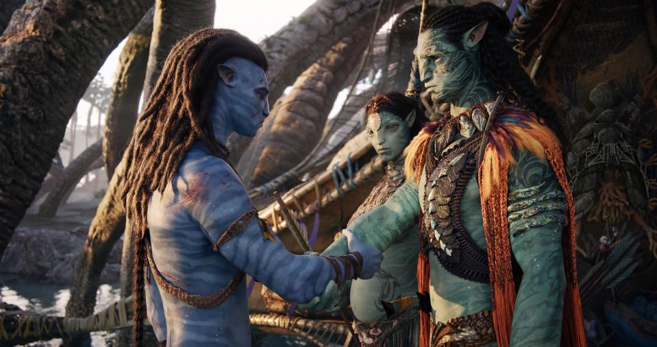 From left: Jake Sully (Sam Worthington), Ronal (Kate Winslet) and Tonowari (Cliff Curtis) in 20th Century Studios' "Avatar: The Way of Water."
