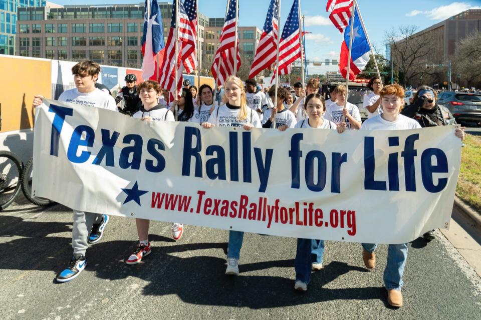 Anti-abortion rights supporters take part in a 