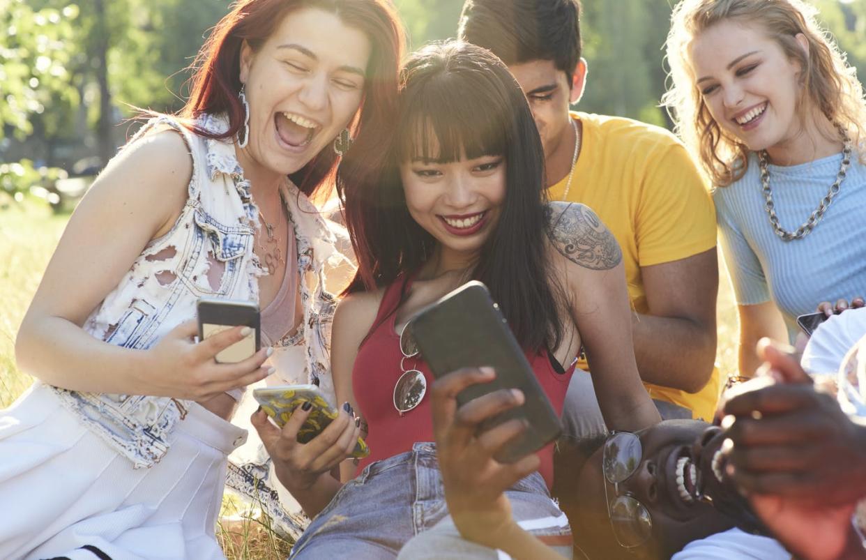 <span class="caption">Teens and young adults spend several hours a day looking at their phones and watching videos, many of which might contain product placements for vaping.</span> <span class="attribution"><a class="link " href="https://www.gettyimages.com/detail/photo/group-of-friends-having-fun-royalty-free-image/1138899799?adppopup=true" rel="nofollow noopener" target="_blank" data-ylk="slk:Flashpop/Getty Images;elm:context_link;itc:0;sec:content-canvas">Flashpop/Getty Images</a></span>