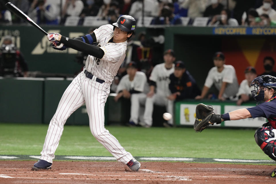 Shohei Ohtani of Japan swings and misses while batting against the Czech Republic during their Pool B game at the World Baseball Classic at the Tokyo Dome, Japan, Saturday, March 11, 2023. (AP Photo/Eugene Hoshiko)