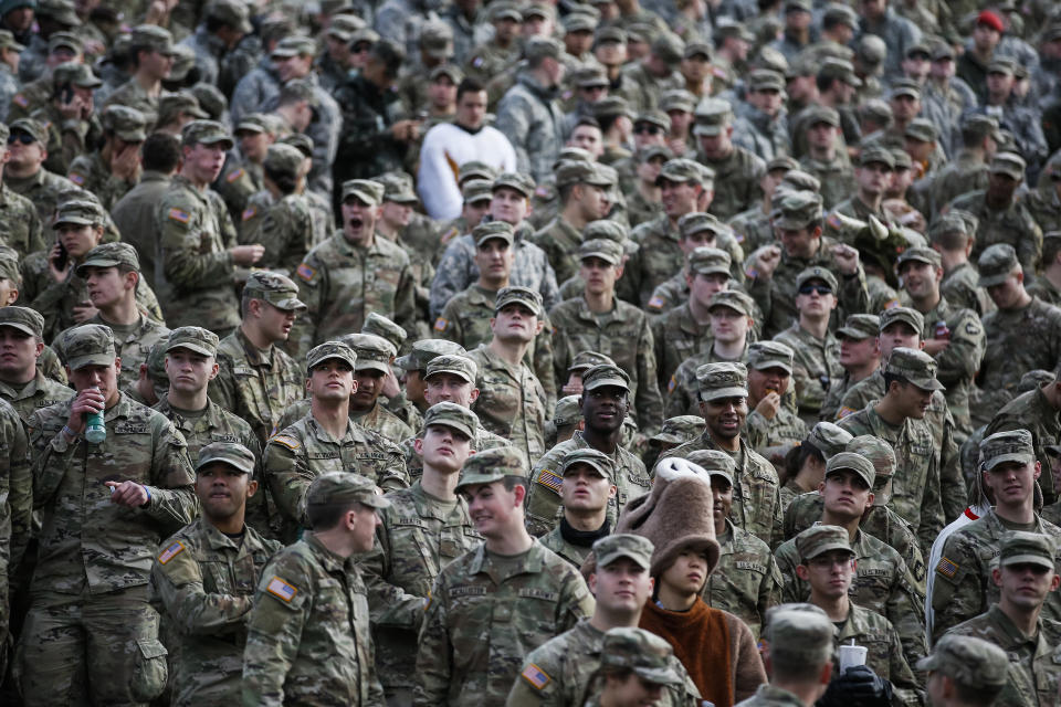 Cadets attend the NCAA college football game between the Army Black Knights and Massachusetts at Michie Stadium, Saturday, Nov. 20, 2021, in West Point, N.Y. The U.S. military academies provide a key pipeline into the leadership of the armed services and have welcomed more racially diverse students each year for the better part of the last decade. (AP Photo/Eduardo Munoz Alvarez)