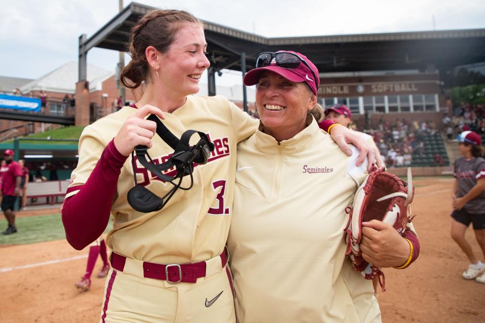 Florida State Seminoles starting pitcher Kathryn Sandercock (32) and head coach Lonni Alameda celebrate the Seminoles’ 1-0 victory over the South Carolina Gamecocks in the Tallahassee Regional Championship game Sunday, May 21, 2023. 