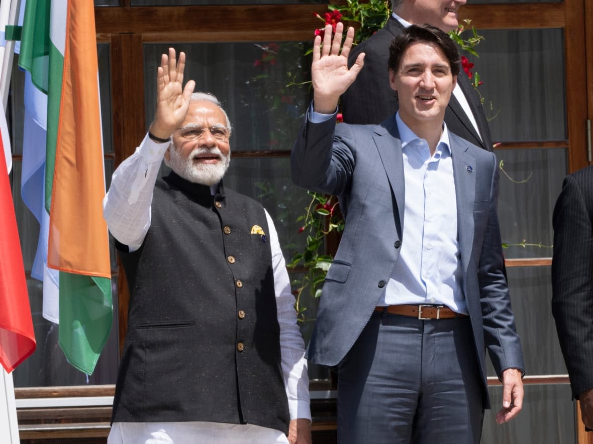 Prime Minister Justin Trudeau and Indian Prime Minister Narendra Modi wave during a family photo at the G7 Summit in Schloss Elmau on Monday, June 27, 2022. (Paul Chiasson/Canadian Press - image credit)