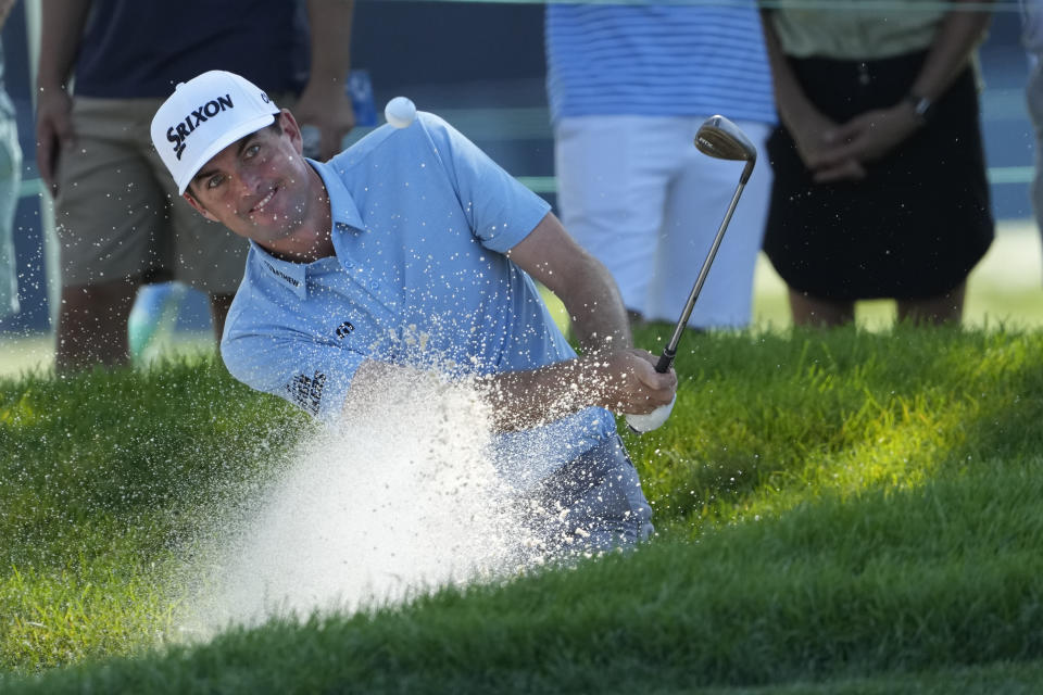 Keegan Bradley watch his shot out of a bunker on the eighth green during the pro-am round of the BMW Championship golf tournament, Wednesday, Aug. 16, 2023, in Olympia Fields, Ill. (AP Photo/Charles Rex Arbogast)