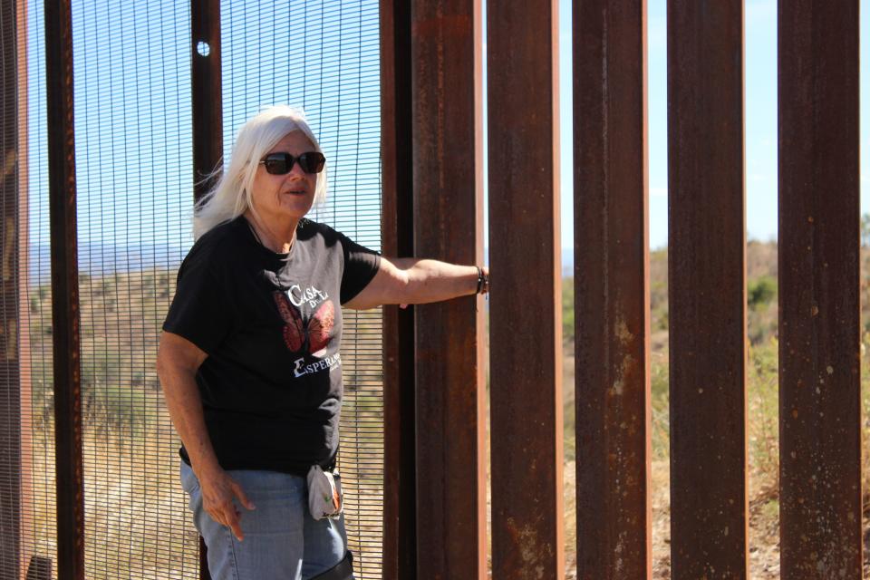 Gail Kocourek, education and media coordinator with Tucson Samaritans, is pictured at the Arizona-Mexico border wall near Sasabe on Friday, October 13, 2023.