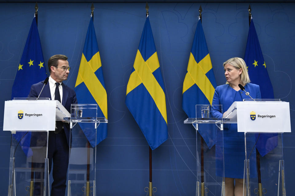 Sweden's Prime Minister Magdalena Andersson, right, and the Moderate Party's leader Ulf Kristersson give a news conference in Stockholm, Sweden, Monday, May 16, 2022. Sweden's government has decided to apply for a NATO membership. (Henrik Montgomery/TT News Agency via AP)