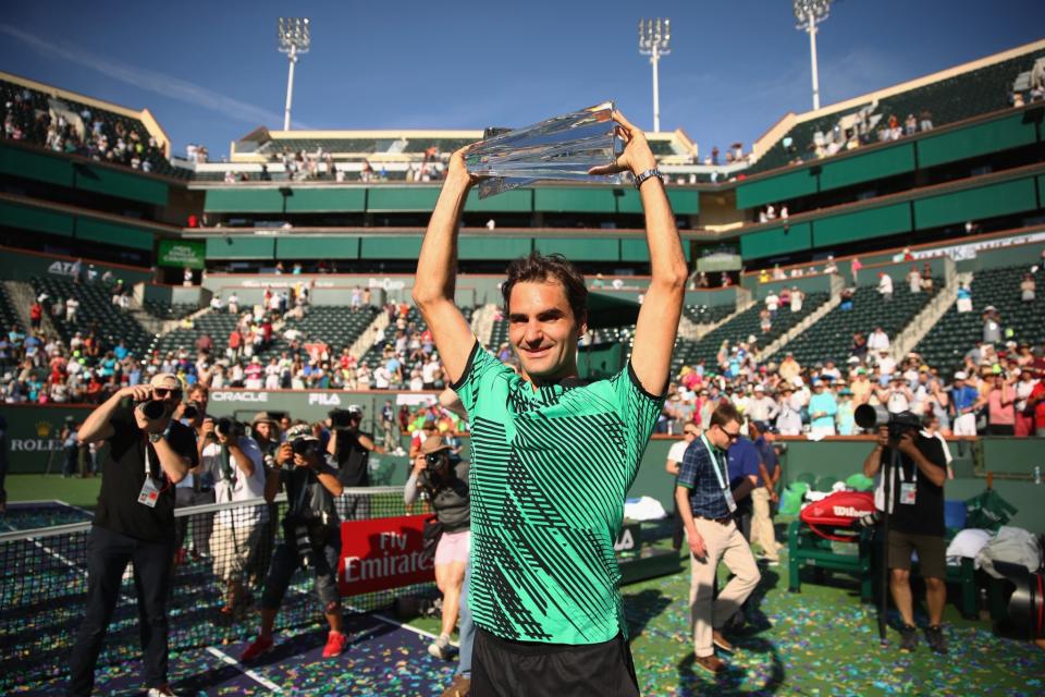 Roger Federer holds the BNP Paribas Open trophy