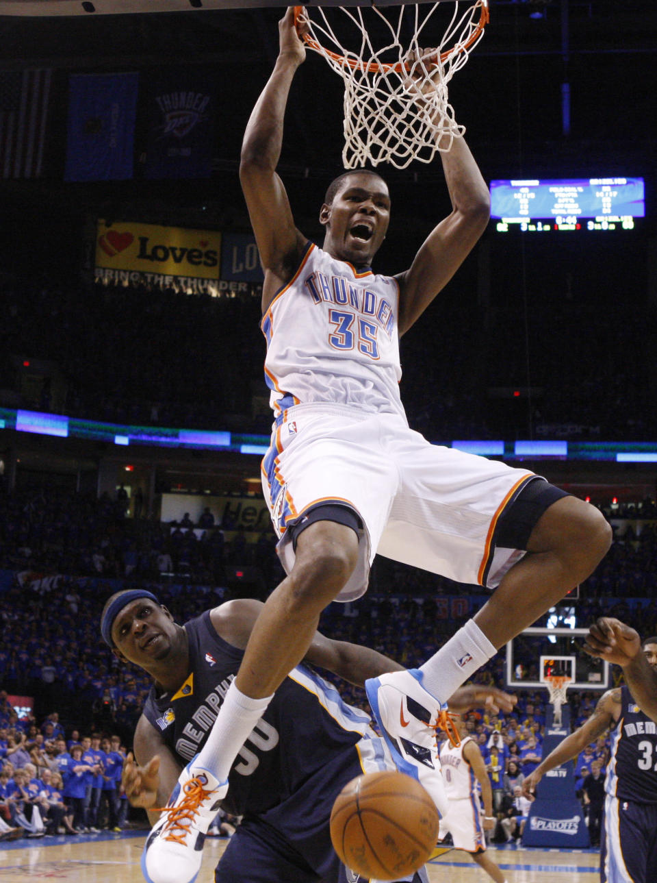 In this May 15, 2011, file photo, Oklahoma City Thunder forward Kevin Durant, front, celebrates after dunking in front of Memphis Grizzlies forward Zach Randolph during Game 7 of a second-round NBA basketball playoff series in Oklahoma City. (AP Photo/Sue Ogrocki, File)