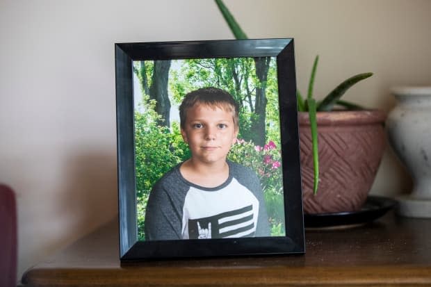 A photo of Carson Crimeni is displayed in his grandfather's home in Langley, British Columbia on Aug. 9, 2019. (Ben Nelms/CBC - image credit)