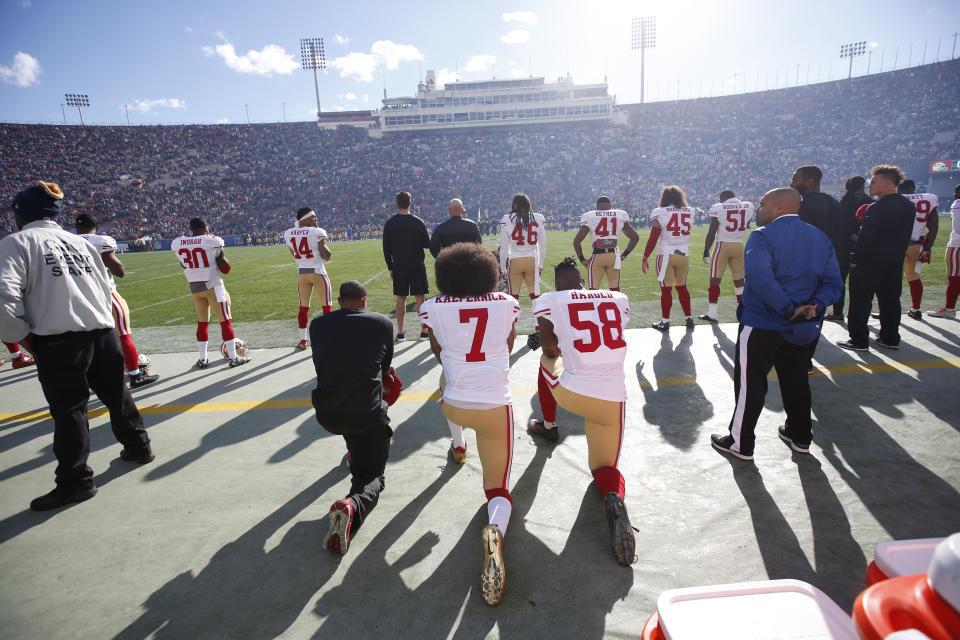 LOS ANGELES, CA - DECEMBER, 24: Eric Reid #35, Colin Kaepernick #7 and Eli Harold #58 of the San Francisco 49ers kneel on the sideline, during the anthem, prior to the game against the Los Angeles Rams at the Los Angeles Coliseum on December 24, 2016 in Los Angeles, California. The 49ers defeated the Rams 22-21. (Photo by Michael Zagaris/San Francisco 49ers/Getty Images) 