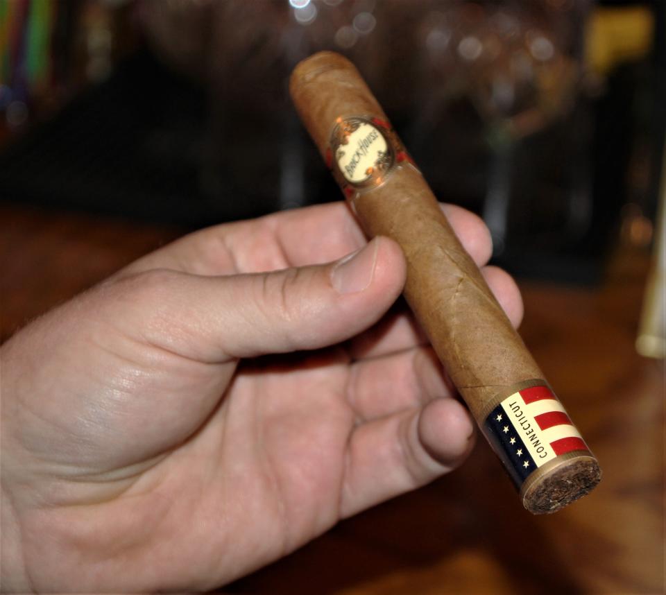 This is a closeup photograph of a J.C. Newman Brickhouse Double Connecticut Toro cigars sold at Shovel City Drinkery in Marion. Shovel City owner Derek Mullins said the Brickhouse is a quality, flavorful cigar.