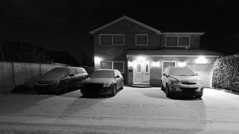 Front of a house shot through a security camera. - Photo: Paul Briden (Shutterstock)