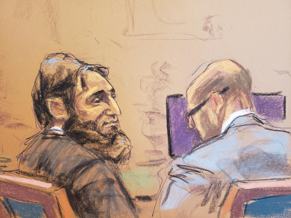 Sayfullo Saipov a member of his court-appointed defense team at this federal trial on Jan. 26 in this courtroom sketch. (Jane Rosenberg/Reuters)