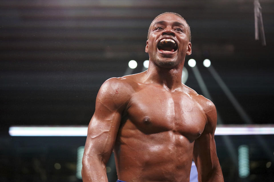FILE - Errol Spence Jr. reacts during a world welterweight championship boxing match against Yordenis Ugas, from Cuba, April 16, 2022, in Arlington, Texas. Spence and Terence Crawford will meet in a much anticipated showdown when they fight for the undisputed welterweight championship July 29, 2023, in Las Vegas. (AP Photo/Jeffrey McWhorter, File)