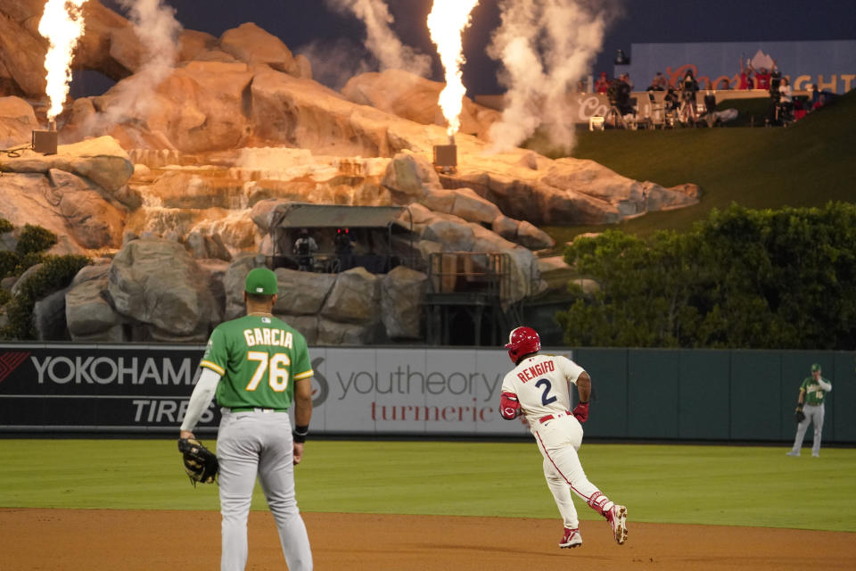Los Angeles Angels' Luis Rengifo, right, heads to second after hitting a solo home run as Oakland Athletics first baseman Dermis Garcia watches during the first inning of a baseball game Thursday, Sept. 29, 2022, in Anaheim, Calif. (AP Photo/Mark J. Terrill)