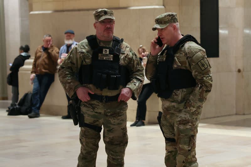 New York National Guard members stand guard inside Grand Central Station in New York City