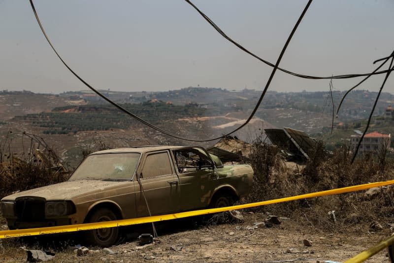 A view of a destroyed car in front of a pro-Iranian Hezbollah three-story building that was demolished in an Israeli overnight air raid in the southern Lebanese village of Janata, where at least one person was killed and more than seven others wounded. Marwan Naamani/dpa