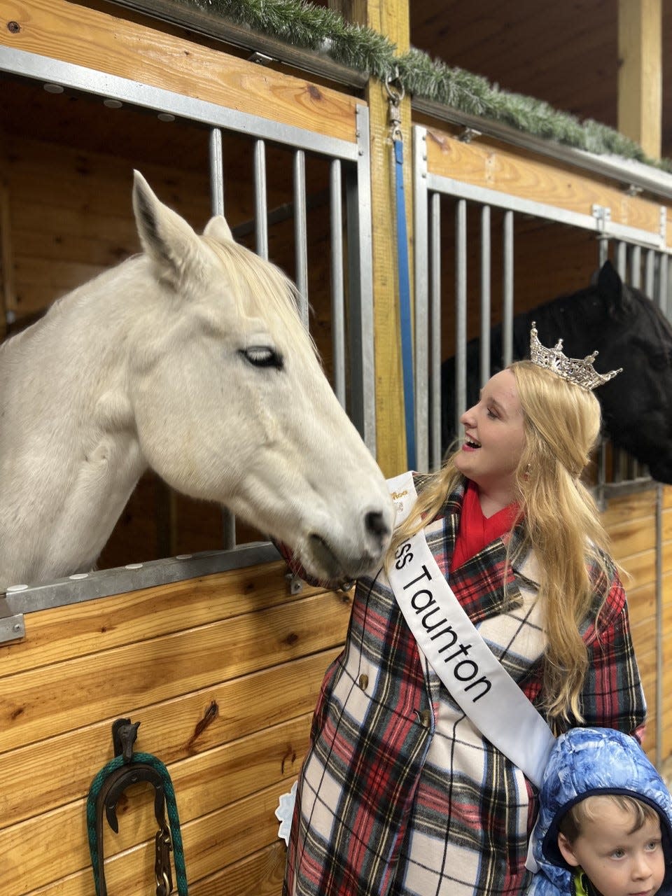 Miss Taunton 2023 Lily Jeswald attended the holiday opening for Deep Pond Farm and Stables in East Taunton with her nephew Brady Pelland.
