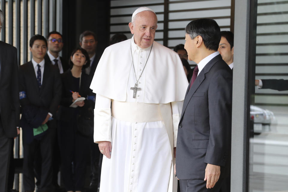 Pope Francis, center, prepares to leave after meeting with Japan's Emperor Naruhito, right, at the Imperial Palace in Tokyo, Monday, Nov. 25, 2019. (AP Photo/Koji Sasahara)