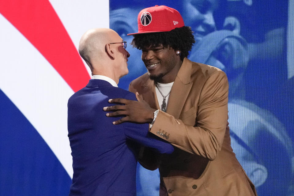 Jarace Walker greets NBA Commissions Adam Silver after being selected eighth overall by the Washington Wizards during the NBA basketball draft, Thursday, June 22, 2023, in New York. (AP Photo/John Minchillo)