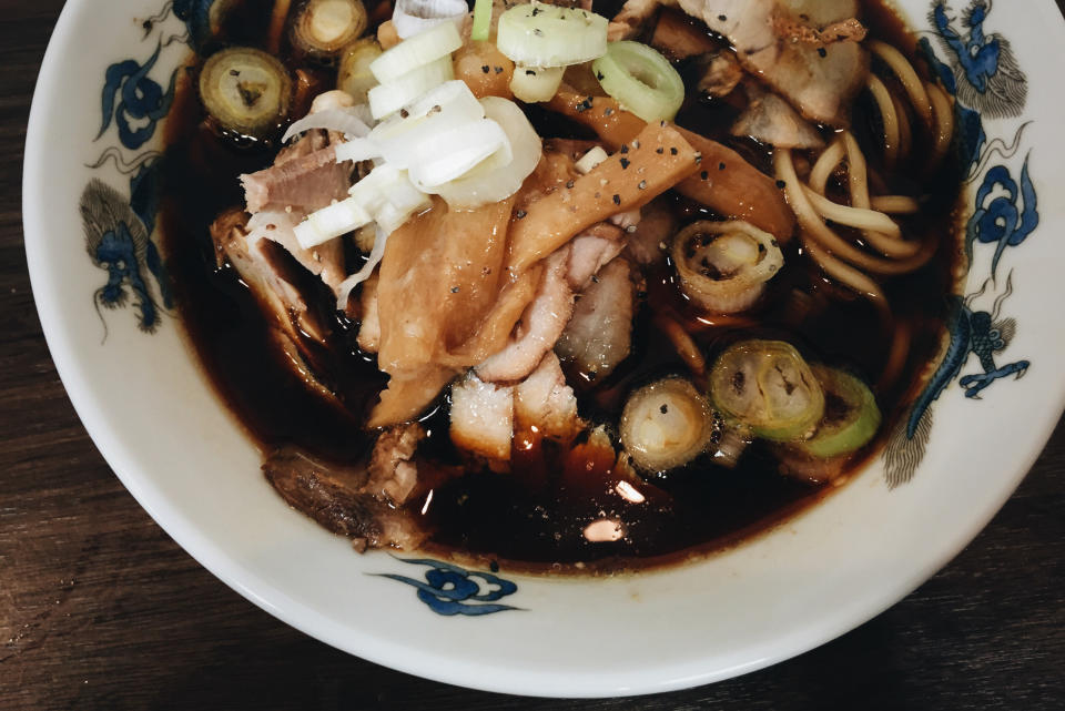 This jet-black ramen is seasoned with dark and salty soy sauce, chicken and fish stock, and pork. Its hearty flavor has a practical origin: apparently, it was designed to satisfy the hunger of hard-working construction workers in the Toyoma prefecture in the 1950s. To temper the salty flavor, this dish is often served with a serving of eggs or rice. 