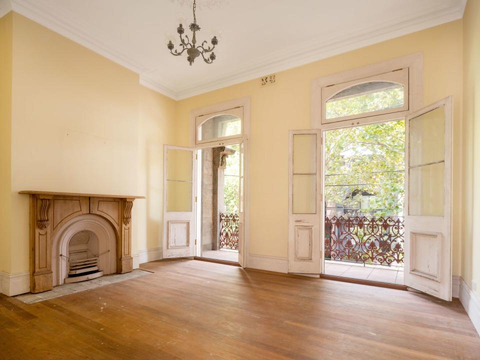 Upstairs picture of 448 Bourke Street, Surry Hills with double French doors open  showing the balcony and trees outside
