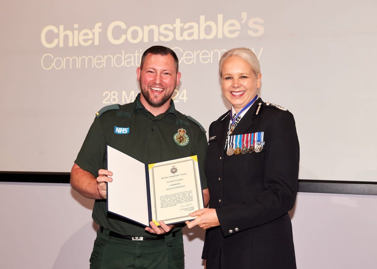 Dean Hawkins has been handed an award for his bravery (London Ambulance Service)