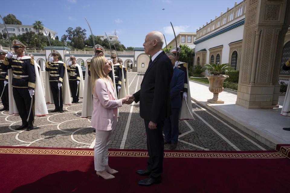Italian Premier Giorgia Meloni, left, is greeted by Tunisian President Kais Saied in Tunis, Sunday, June 11, 2023. Tunisia's president is hosting the leaders of Italy, the Netherlands and the European Union for talks aimed at smoothing the way for an international bailout. The European leaders want to restore stability to a country that has become a major source of migration to Europe. (Italian Premier Office via AP, ho)