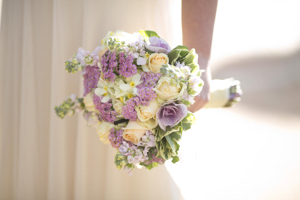 FILE - A bride holds a bouquet during her wedding in Ein Hemed, Israel on Dec. 14, 2017. (AP Photo/Ariel Schalit, File)