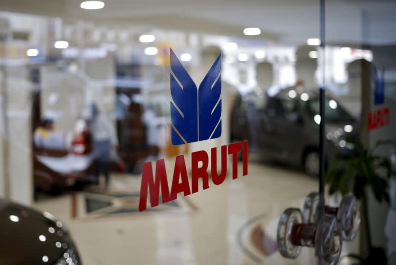 FILE PHOTO: The logo of Maruti Suzuki India Limited is seen on a glass door at a showroom in New Delhi