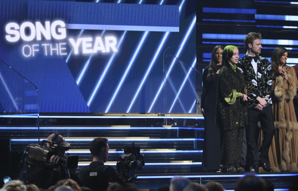 Billie Eilish, left, and Finneas O'Connell accept the award for song of the year for "Bad Guy" at the 62nd annual Grammy Awards on Sunday, Jan. 26, 2020, in Los Angeles. (Photo by Matt Sayles/Invision/AP)