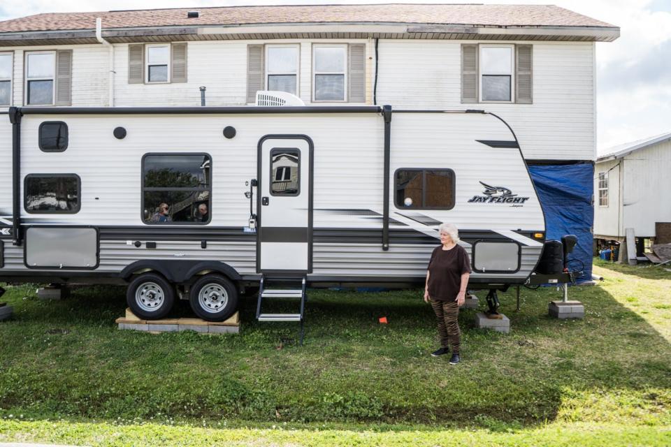 Marilyn Picou of Chauvin stands outside the FEMA trailer she's been given that had been set up facing a ditch, causing safety and accessibility concerns, in March. Contractors finally fixed and rotated the camper the first week of May, which is when Picou received the key.