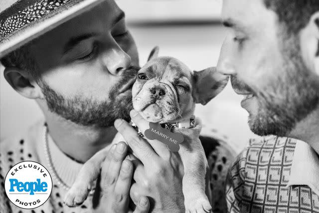 <p>Ford Fairchild</p> Adam Mac (left) and Lee Pfund with their dog Pearl