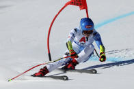 United States' Mikaela Shiffrin speeds down the course during an alpine ski, women's World Championships super G, in Meribel, France, Wednesday, Feb. 8, 2023. (AP Photo/Alessandro Trovati)