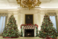 The State Dining Room of the White House is decorated for the holiday season during a press preview of the White House holiday decorations, Monday, Nov. 29, 2021, in Washington. (AP Photo/Evan Vucci)