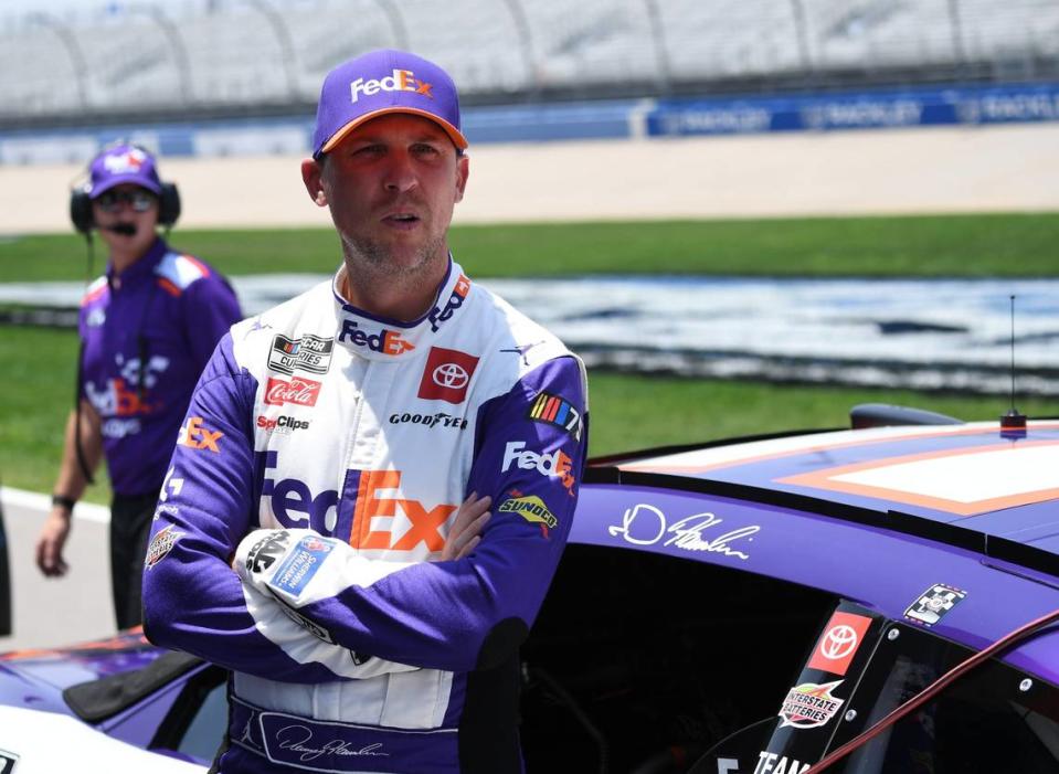 Jun 24, 2023; Nashville, Tennessee, USA; NASCAR Cup Series driver Denny Hamlin (11) waits beside his car for qualifying before the Ally 400 at Nashville Superspeedway. Mandatory Credit: Christopher Hanewinckel-USA TODAY Sports