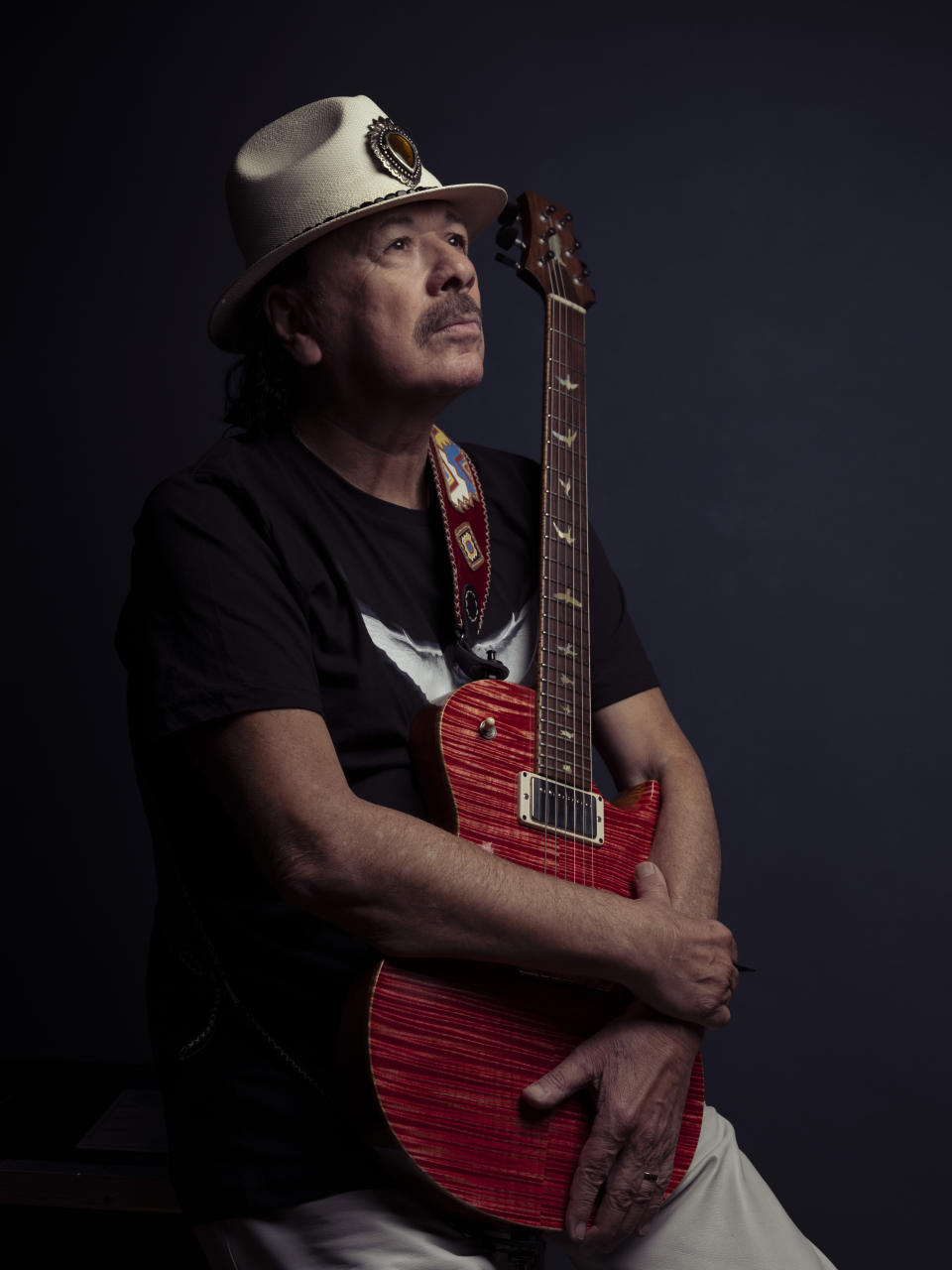 Carlos Santana poses for a portrait on Friday, June 16, 2023, in New York. (Photo by Drew Gurian/Invision/AP)